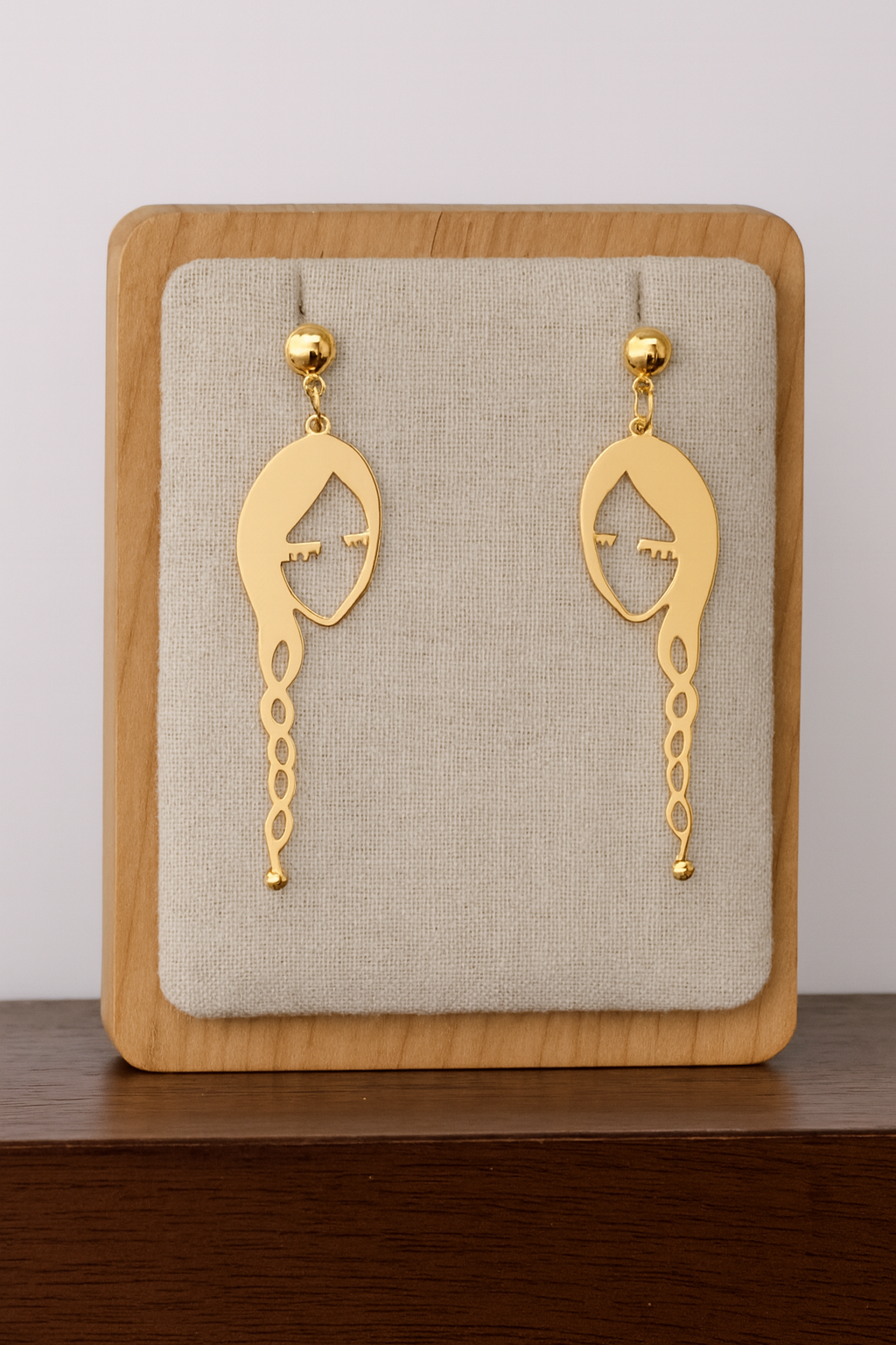 Abstract Face with Braid Earrings